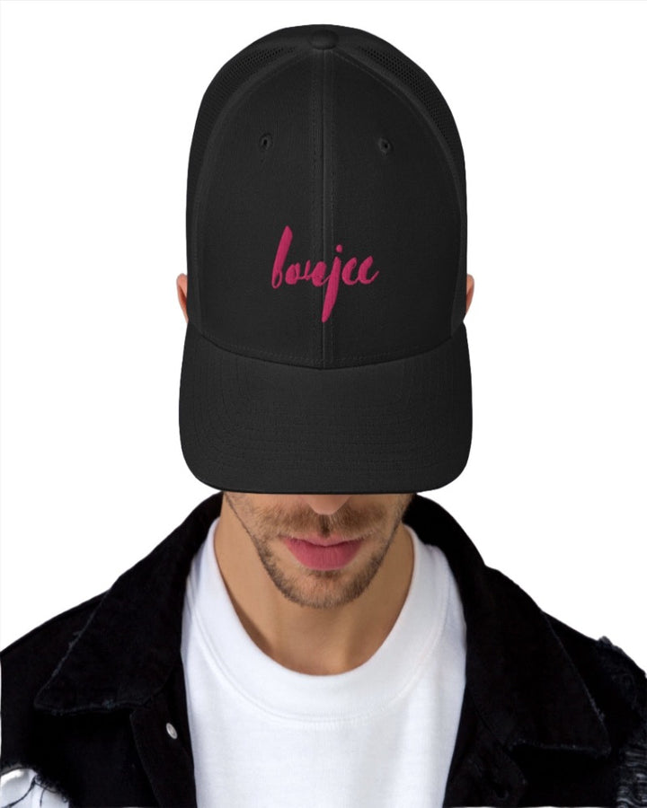 Black trucker hat with boujee in a bold pink text design, complete with a breathable mesh back, and an adjustable snap closure.