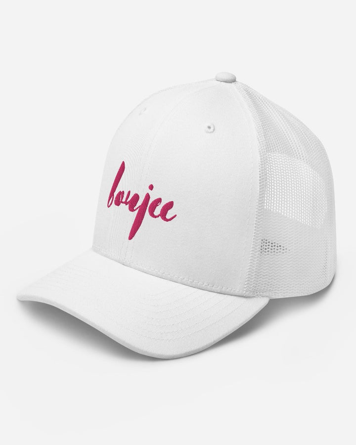 White trucker hat with boujee in a bold pink text design, complete with a breathable mesh back, and an adjustable snap closure.