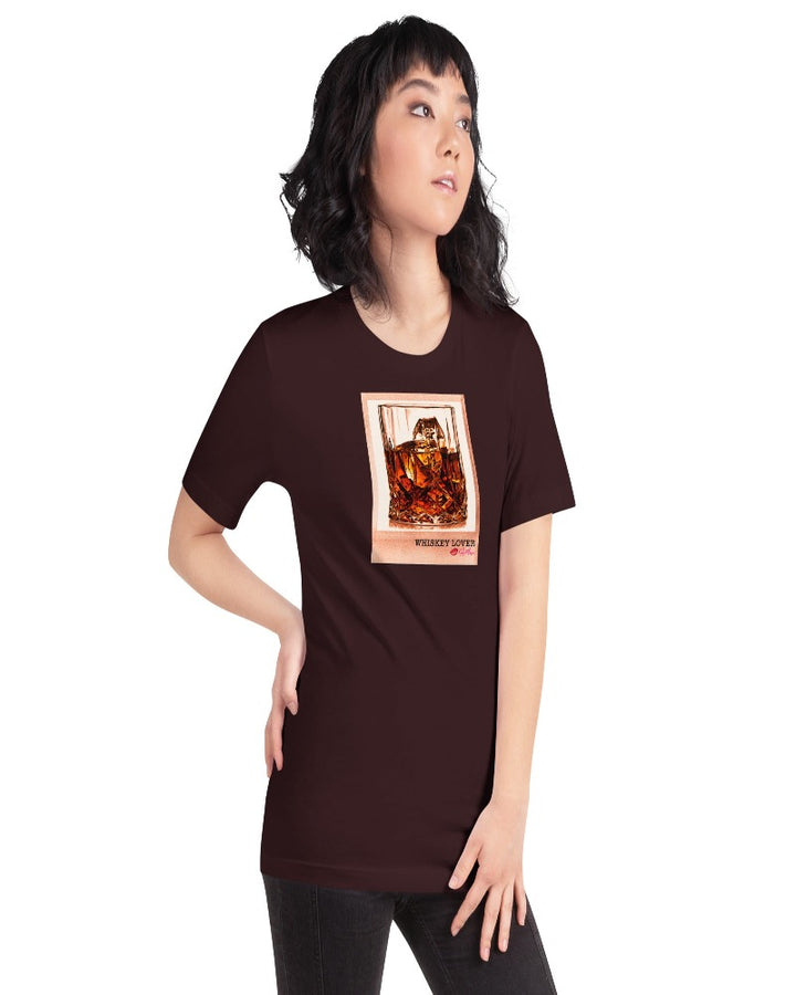 Oxblood Black colored T-shirt available in various sizes, featuring a rocks glass of whiskey graphics with a text design "Whiskey Lover" with the logo Kiki Mason Logo