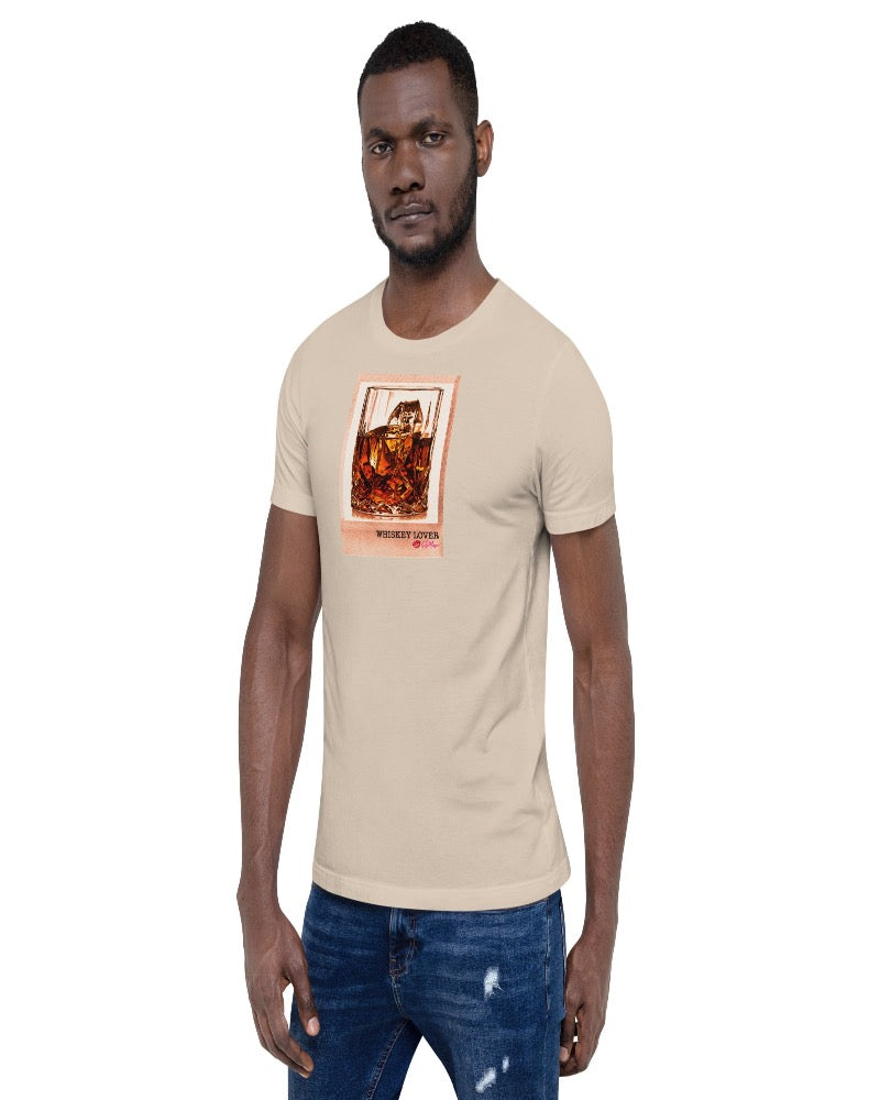 Soft cream colored T-shirt available in various sizes, featuring a rocks glass of whiskey graphics with a text design "Whiskey Lover" with the logo Kiki Mason Logo