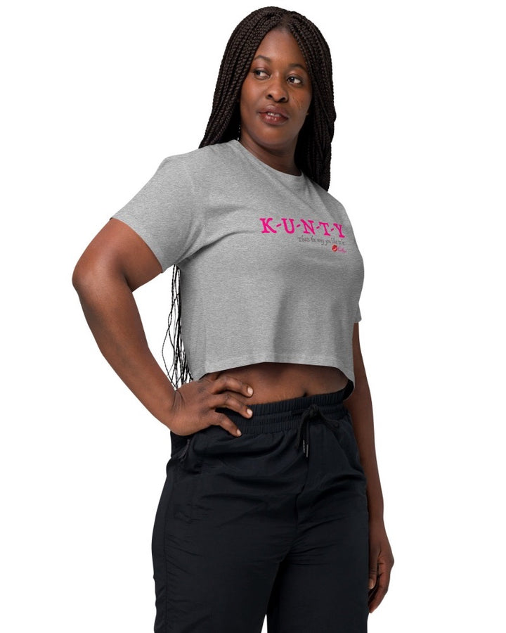 Athletic heather crop top with bold print design, “K-U-N-T-Y” in hot pink raspberry text design, and “that’s the way you like to be” in soft grey text printed on the front. Plain athletic heather back