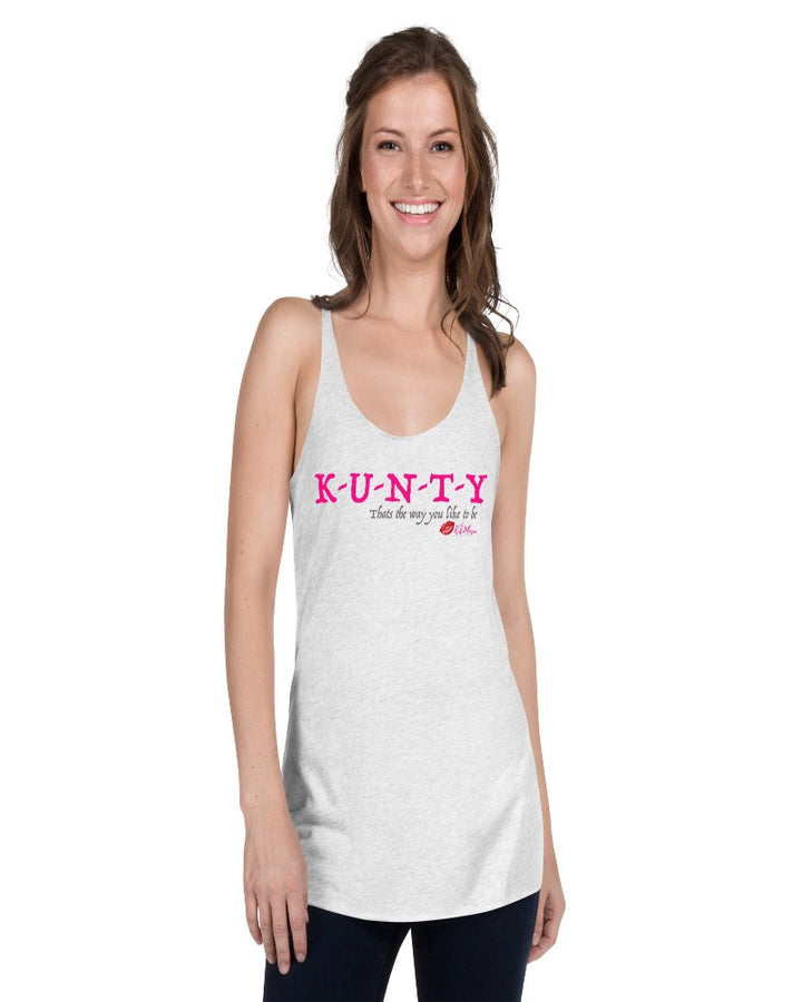 White vintage racer back tank top with “K-U-N-T-Y” in hot pink raspberry text design, with soft grey “That’s the way you like to be” text design. Plain white back