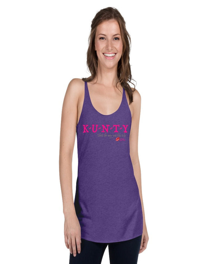 Purple rush vintage racer back tank top with “K-U-N-T-Y” in hot pink raspberry text design, with soft grey “That’s the way you like to be” text design. Plain purple rush back