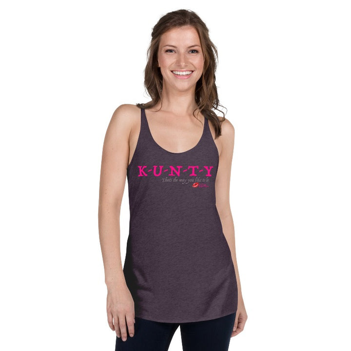 Purple vintage racer back tank top with “K-U-N-T-Y” in hot pink raspberry text design, with soft grey “That’s the way you like to be” text design. Plain purple back